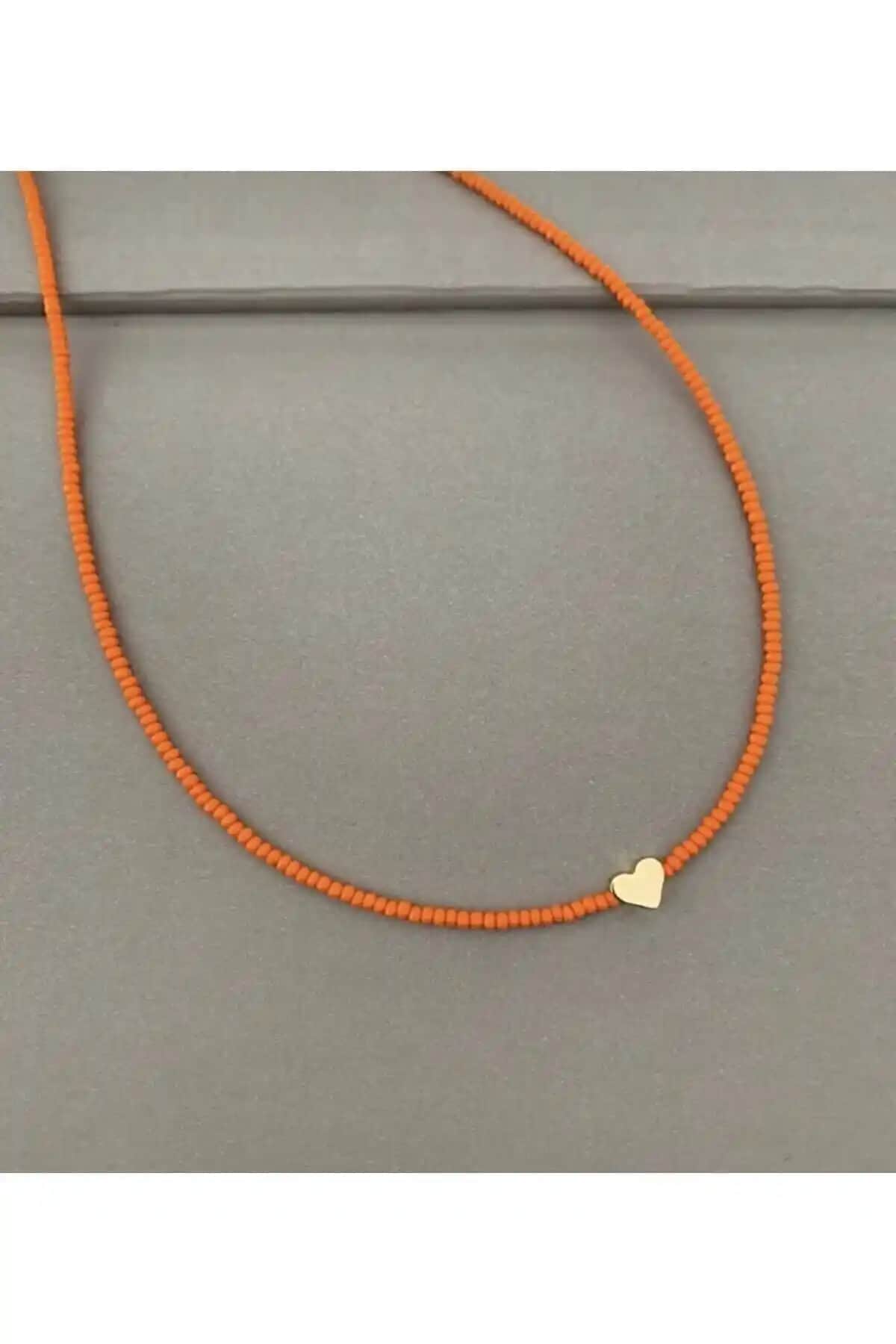 Misto Kalpli Turuncu Boncuk Kolye: Şık ve Enerjik Bir Aksesuar Seçeneği